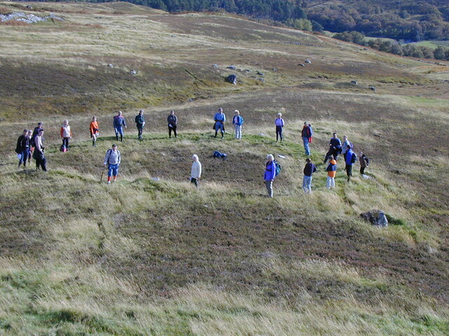 Close up of group at hut circle at Grudie.JPG