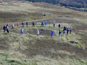 Close up of group at hut circle at Grudie.JPG