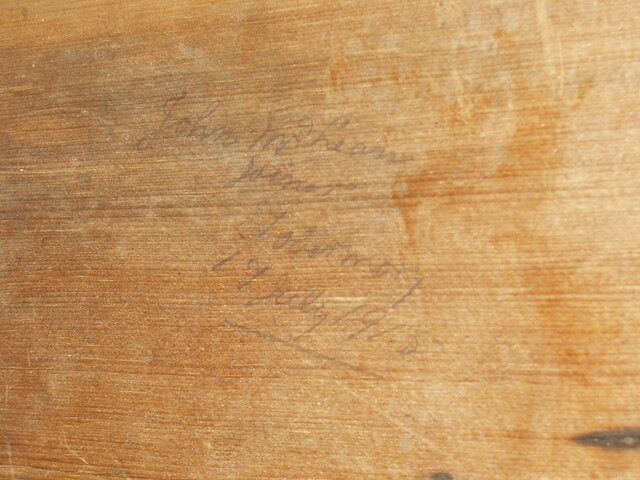 Joiner's mark and date on pew.JPG