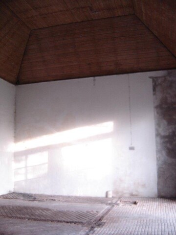 5. Inside stable showing plastered wall and timber ceiling.jpg