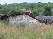 EHG5196_06. view from south of steading with collapsed roof and collapsed wall.JPG